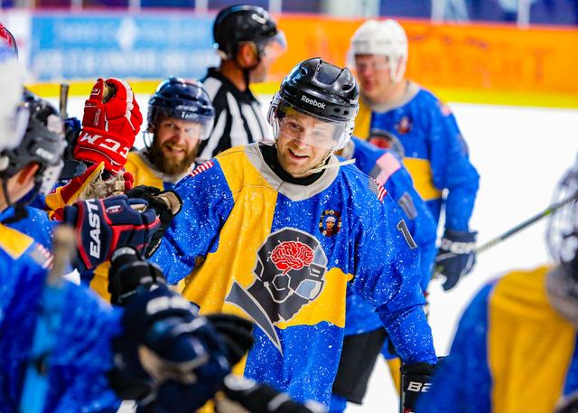 A Sweden player celebrates with teammates behind the play