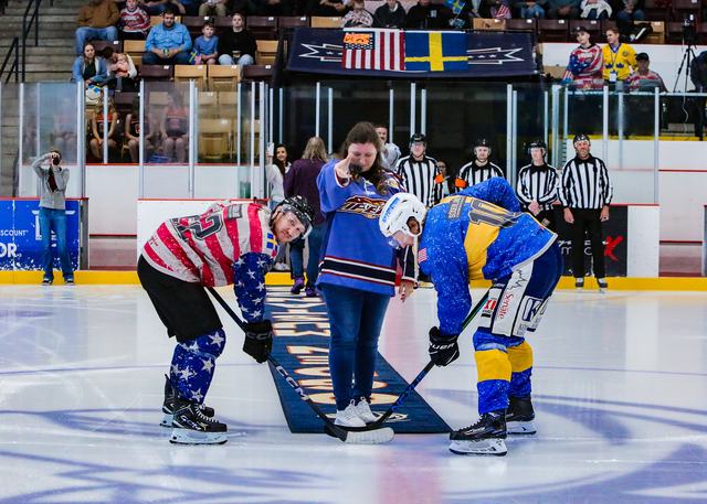 Ceremonial puck drop between the Sweden and USA team captains